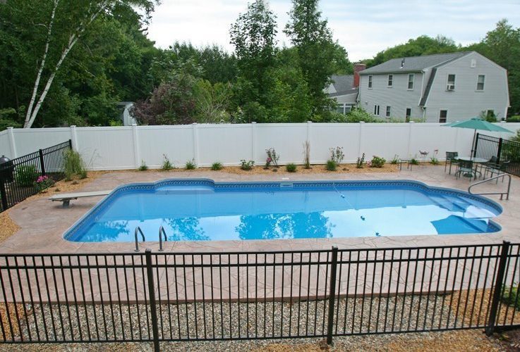 This is a photo of a patrician in ground pool with custom pool house.